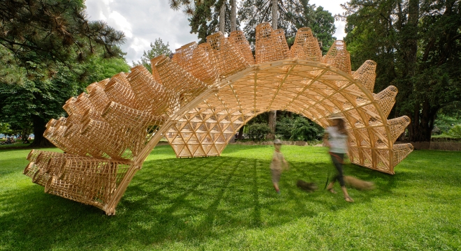 Sunlight Filters Through a Shell-Like Pavilion Covered with Wicker Baskets in Annecy, France